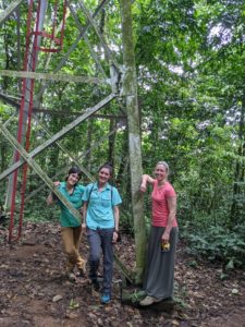 Anna Fagre, Emma Harris, and Rebekah Kading by the famous Zika tower, in Zika Forest, Uganda, May 2021.