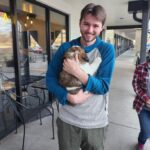 Portrait of Evan Hurtado and his dog